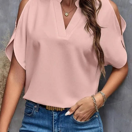 Kris - Effen blouse met inkepingen en eenvoudige elegante split mouwen - Visconte