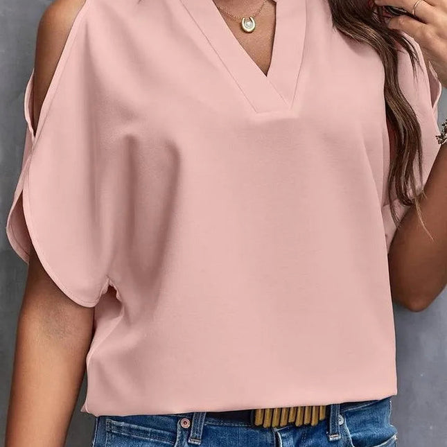 Kris - Effen blouse met inkepingen en eenvoudige elegante split mouwen - Visconte