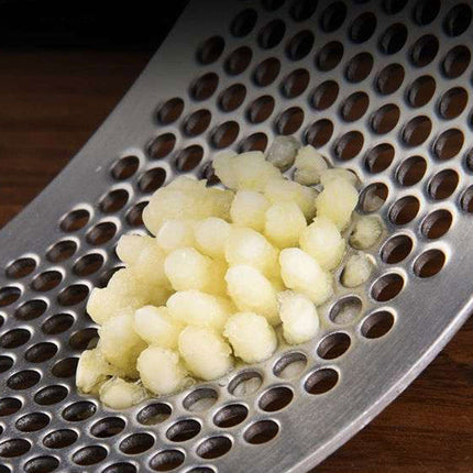 Stainless Steel Garlic Press | Effortless Garlic Crusher | Quick and Easy to Use | Dishwasher Safe Kitchen Tool | Reduces Garlic Odor on Hands | Durable and Long-Lasting Design | Essential for Cooking Prep